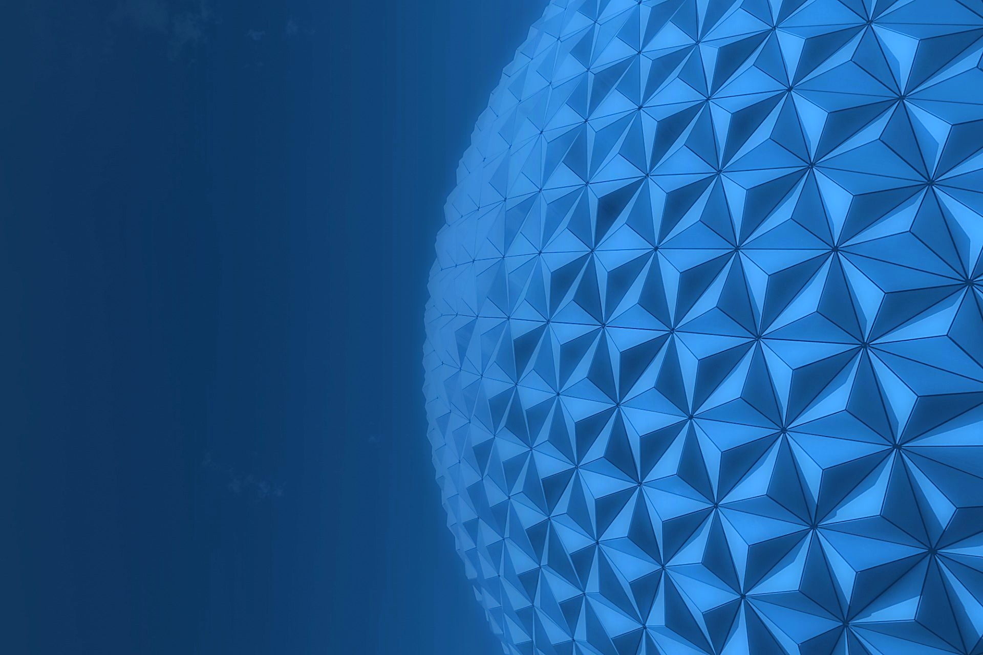 Curving faceted lattice of a geodesic sphere against an open sky