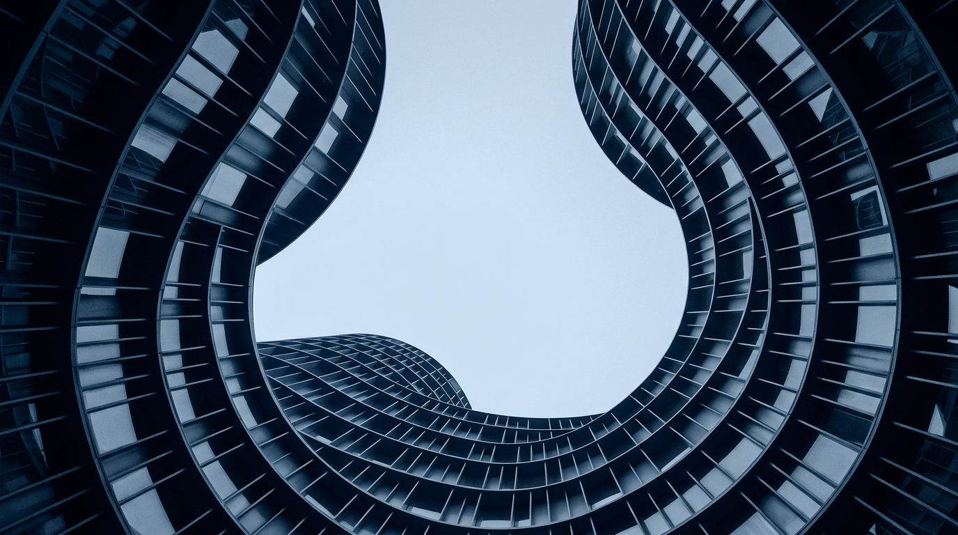 Curved dark glass facades rising towards a bright opening of sky