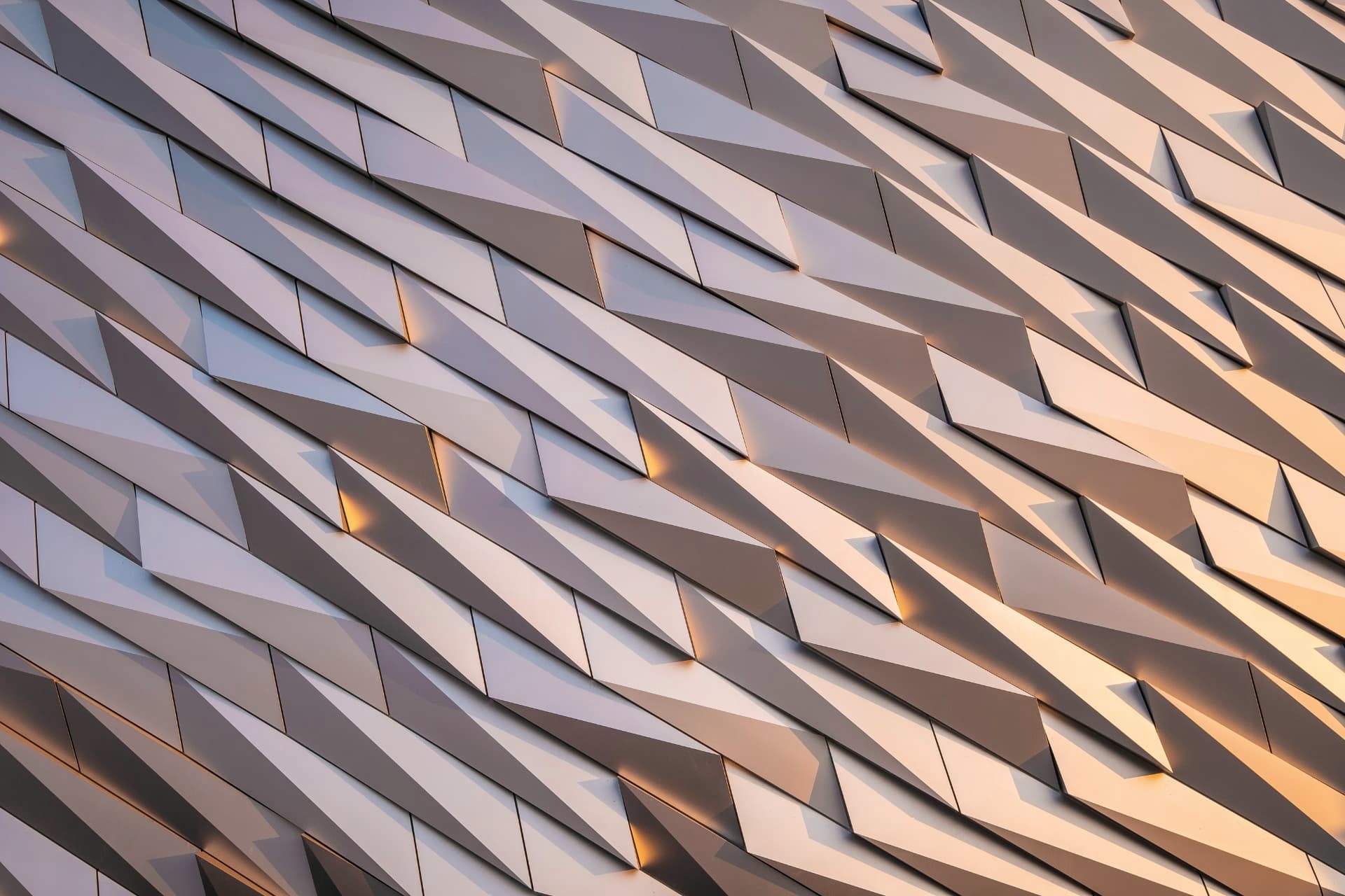 Faceted architectural panels catching warm evening light