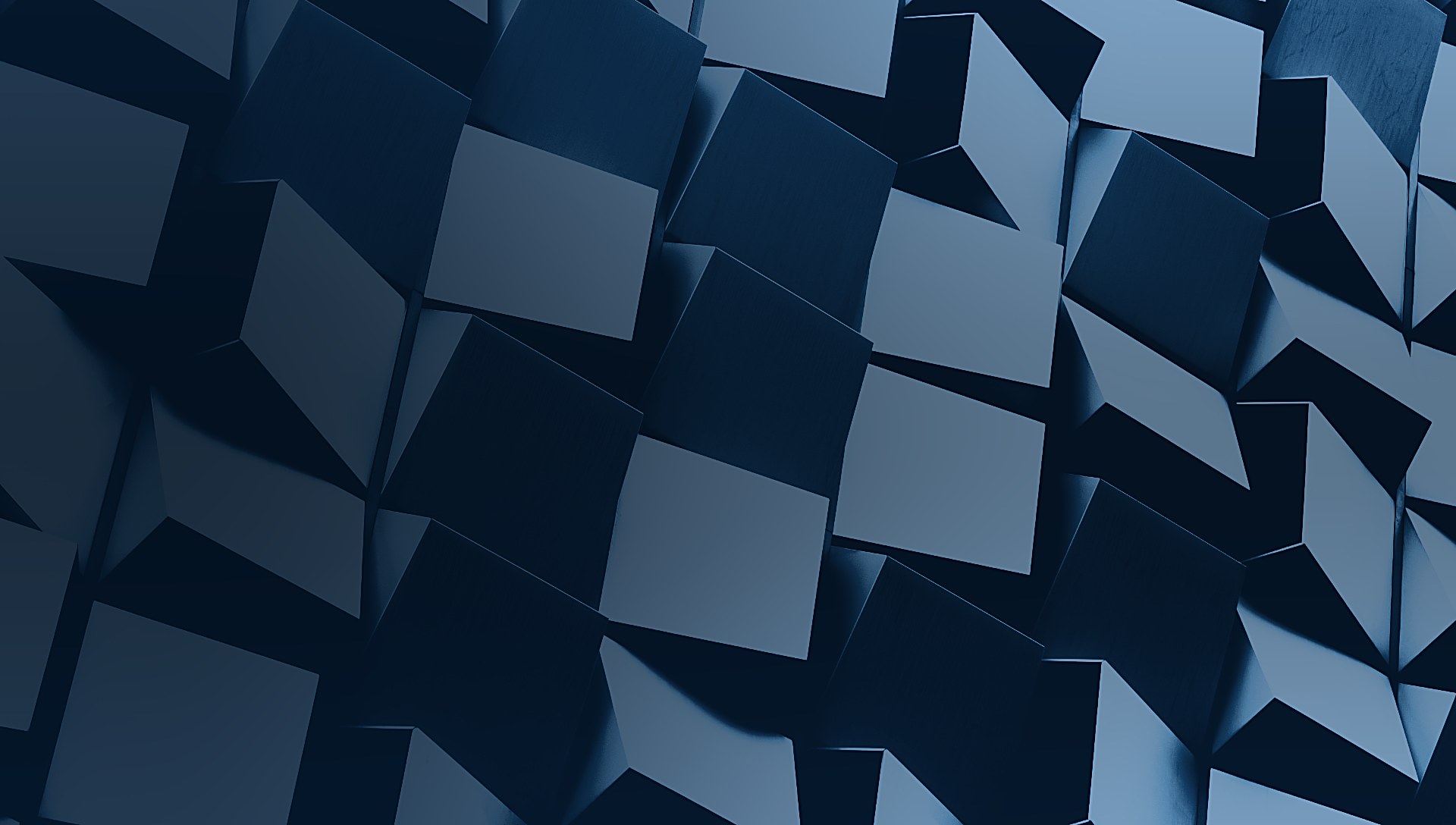 Close view of a modern facade of angled cubic panels in deep navy tones